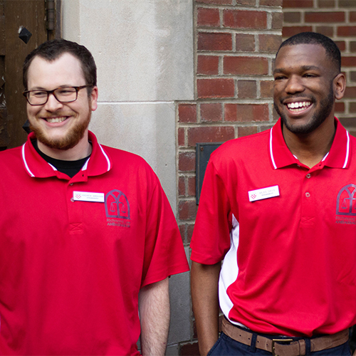 Two smiling law school employees.